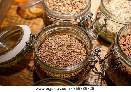 Tastes Of Gin, Botanicals Ingredients For Gin Distillery Process, Pot With Dried Coriander Seeds Clo