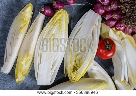Fresh Belgian Endive Or Chicory Bitter Salad Ready To Cook Or Eat Close Up