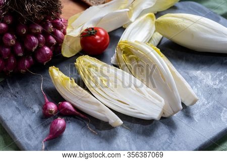 Fresh Belgian Endive Or Chicory Bitter Salad Ready To Cook Or Eat