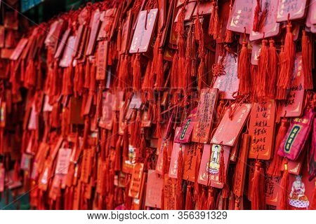 Chongqing, China - Dec 20, 2019: Red Praying Wish Cards Hang On Traditional Stand Written In Chinese