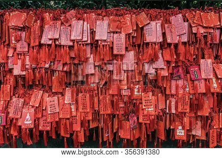 Chongqing, China - Dec 20, 2019: Red Praying Wish Cards Hang On Traditional Stand Written In Chinese