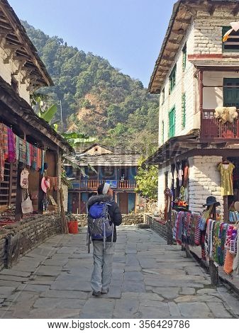 Woman Hiking Through Villages In Ulleri Pokhara In Nepal
