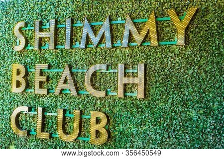 Cape Town, South Africa - October 13, 2019: Sign Outside Front Entrance Of Shimmy Beach Club At The 