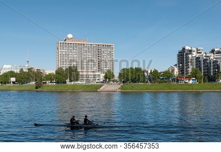 Saint-petersburg, Russia - May 30, 2019: Two Rowing Athletes In A Boat On The Little Nevka River. On