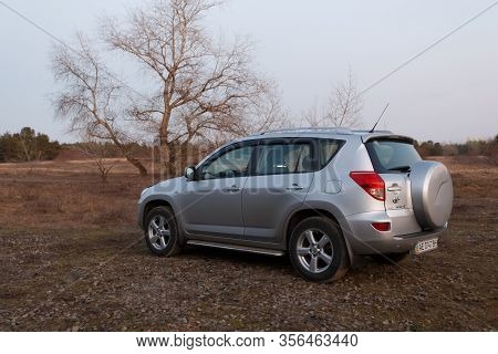 Dnipro, Ukraine - February 19, 2020: Toyota Rav4 2006 Gray Color Near The Forest, Open Space In Twil
