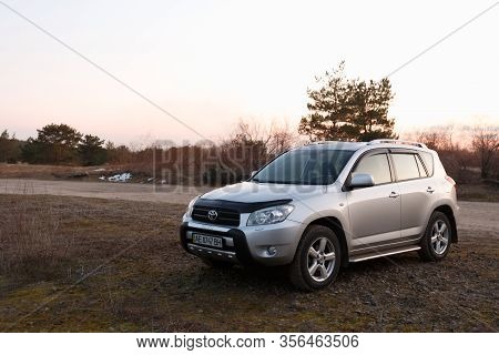Dnipro, Ukraine - February 19, 2020: Toyota Rav4 2006 Gray Color Near The Forest, Open Space In Twil