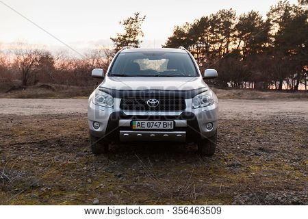 Dnipro, Ukraine - February 19, 2020: Toyota Rav4 2006 Gray Color Near The Forest, Open Space In Twil