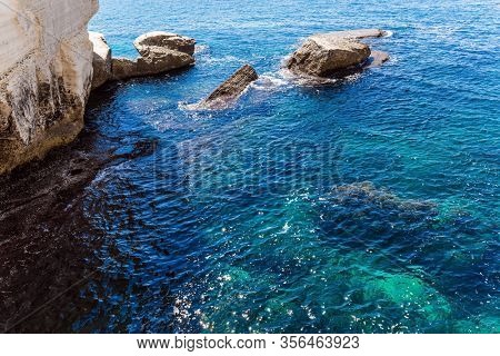 Grottoes Rosh - ha - Nikra - geological formation on the border between Israel and Lebanon. The color of water changes from azure to dark blue. The concept of active and photo tourism