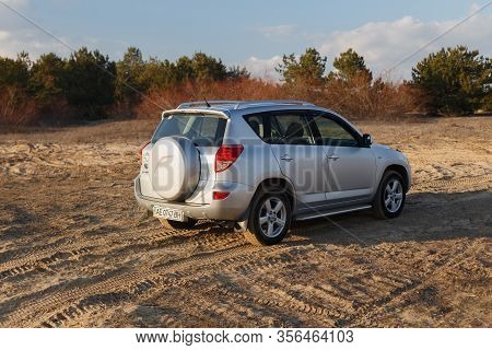 Dnipro, Ukraine - February 19, 2020: Toyota Rav4 2006 Gray Color Among The Sand Near The Forest, Ope