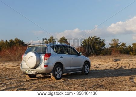 Dnipro, Ukraine - February 19, 2020: Toyota Rav4 2006 Gray Color Among The Sand Near The Forest, Ope