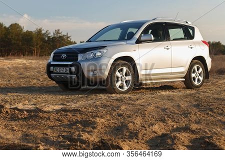 Dnipro, Ukraine - February 19, 2020: Toyota Rav4 2006 Gray Color Among The Sand Near The Forest, Ope