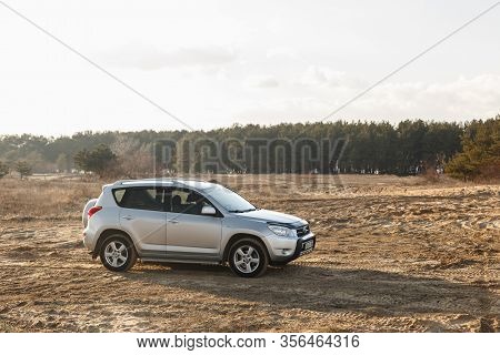Dnipro, Ukraine - February 19, 2020: Toyota Rav4 2006 Gray Color Among The Sand Near The Forest, Ope