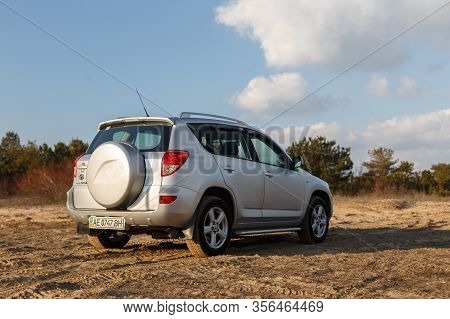Dnipro, Ukraine - February 19, 2020: Toyota Rav4 2006 Gray Color Among The Sand Near The Forest, Ope