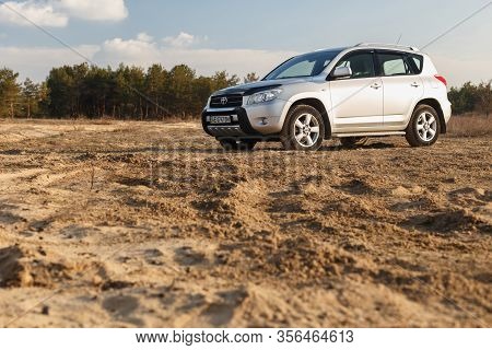 Dnipro, Ukraine - February 19, 2020: Toyota Rav4 2006 Gray Color Among The Sand Near The Forest, Ope