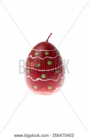 Egg Shape, Oval Easter Candle,red With Green Spots, Isolated, Close Up, White Background