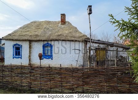 An Old Village House With A Thatched Roof. Ertil. Voronezh Region. Russia. March 2020