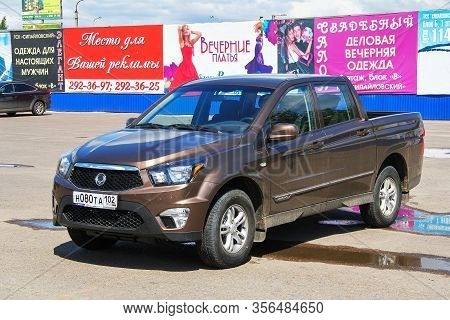 Ufa, Russia - July 28, 2012: Brown Pickup Truck Ssangyong Actyon Sports In The City Street.