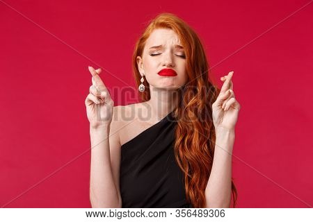 Close-up Portrait Of Hopeful And Dreamy, Begging Young Redhead Woman Cross Fingers Good Luck, Prayin