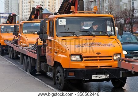 Blocking The Road With Tow Trucks As Part Of The Russian March In Lublino. Inscription: City Vehicle