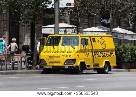 Barcelona, Spain - May 16, 2017: View Of The Yellow Prosegur Armoured Van In Center Of Barcelona. Pr