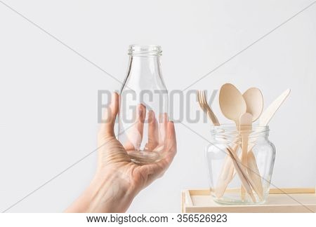 Wood Cutlery Spoons Fork Knife In A Glass Jar Young Caucasian Woman Holding Bottle In Hand On White 