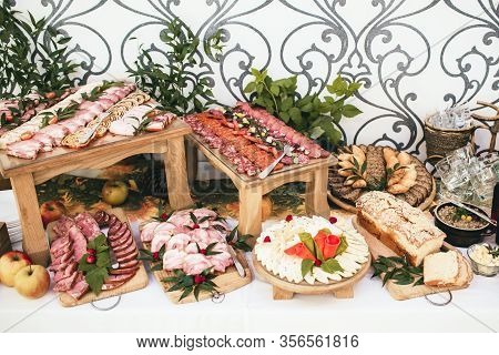 Party Meat Catering Table. Wedding Decorative Ham Slices. Various Meat Snacks Background. Salami Sli