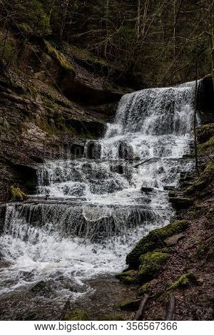 Little Waterfall Down The Canyon In The Middle Of The Green Forest