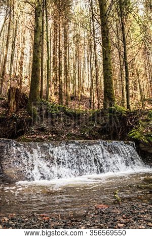 Little Waterfall Down The Canyon In The Middle Of The Green Forest