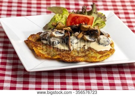 Closeup Of Swiss Roesti With Mushroom Sauce