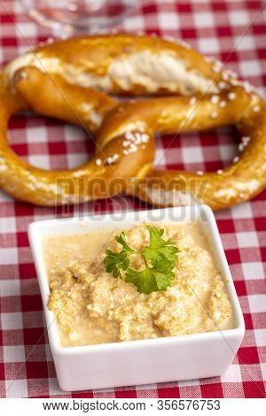 Overview Of A Bavarian Cheese Spread With Pretzel