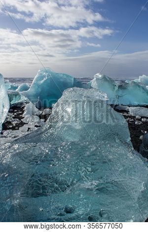 Ice Fields At The Black Pebble Beach, Coast Of Iceland