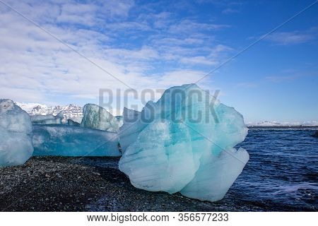 Ice Fields At The Black Pebble Beach, Coast Of Iceland