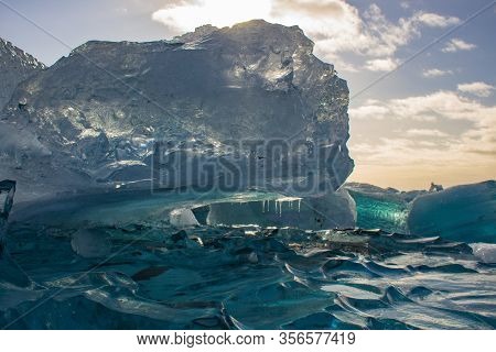Remains Of An Iceberg At The Black Pebble Beach, Coast Of Iceland