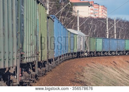Freight Train Moves By The Spring Forest.