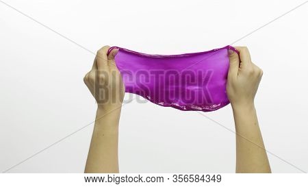 Woman Hands Playing With Oddly Satisfying Purple Slime On White Background. Sticky Gooey Substance. 