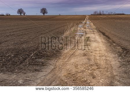 Panorama Of Arable Land Under Amazing Clouds