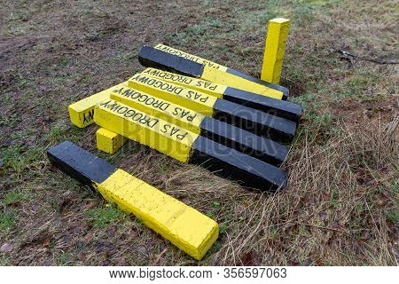 A Yellow Road Post Standing By The Road. Marking Of The Road Lane On The Side Of The Road.