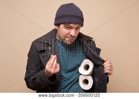 Huckster Man Holding Several Roll Of Toilet Paper. Do You Want To Buy It