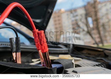 Jump Cables On Car Low Power Battery. Broken Car Start Attempt. Selective Focus.