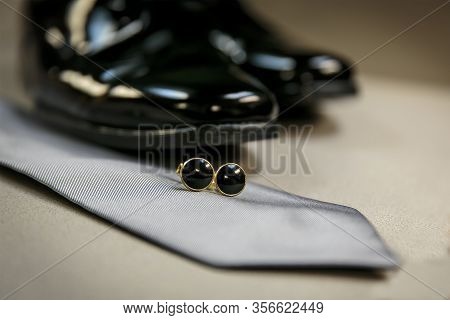 In Preparation For A Wedding, Bridegroom Shoes, Tie And Tie Clasp On A Table