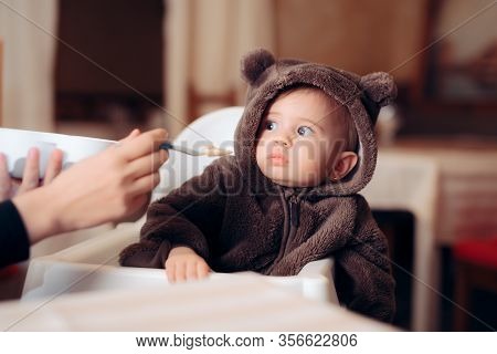 Funny Baby Sitting In Highchair Refusing To Eat