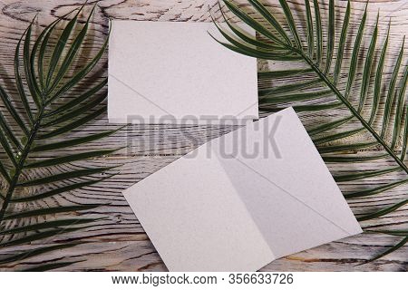 Mosk Up. Abstract Background. Two Cards Of Different Sizes On A Wooden Surface. Texture Of Paper And