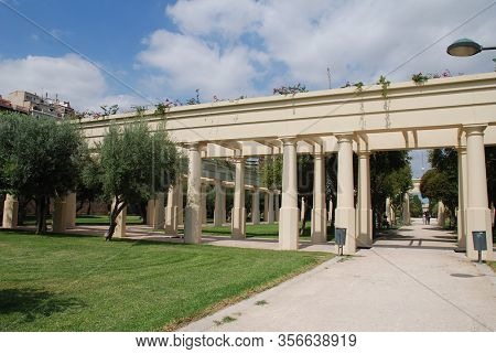 VALENCIA, SPAIN - SEPTEMBER 5, 2019: A decorative colonnade in the Turia river park. The 9 km long park was created after diverting the Turia river to prevent flooding.