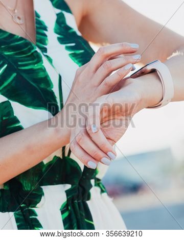 Female Touching Her Smartwatch. Detail View Tech Gear.