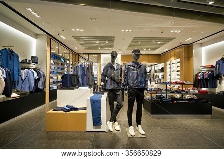 SINGAPORE - APRIL 21, 2019: clothes on display at Hugo Boss store in Singapore Changi Airport. Hugo Boss AG is a German luxury fashion house headquartered in Metzingen.