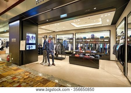 SINGAPORE - APRIL 21, 2019: clothes on display at Hugo Boss store in Singapore Changi Airport. Hugo Boss AG is a German luxury fashion house headquartered in Metzingen.