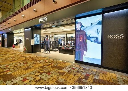 SINGAPORE - APRIL 21, 2019: Hugo Boss storefront in Singapore Changi Airport. Hugo Boss AG is a German luxury fashion house headquartered in Metzingen.