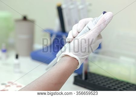Scientist Working In His Laboratory. A Blood Test Is A Laboratory Analysis Performed On A Blood Samp