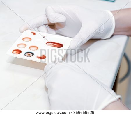 Scientist Working In His Laboratory. A Blood Test Is A Laboratory Analysis Performed On A Blood Samp