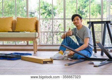 Handyman Installing Wooden Bench In New House. House Renovation Service. Morning Work Atmosphere In 